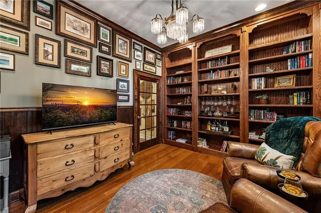 a view of a livingroom with furniture and a chandelier