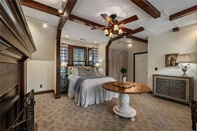 a bedroom with furniture and a window