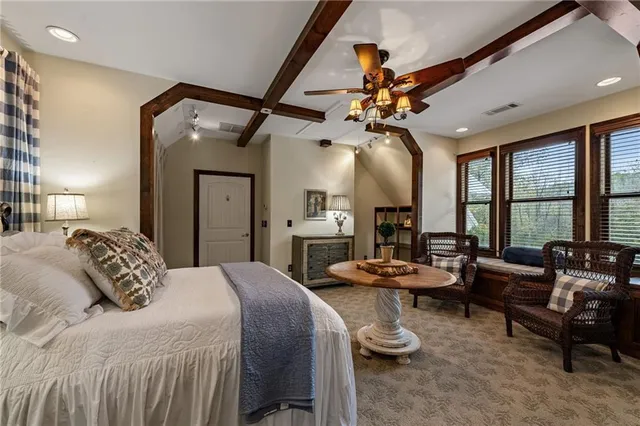 a living room with furniture and a lamp