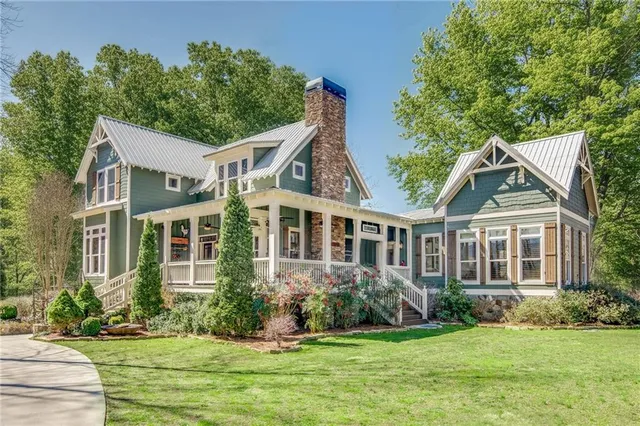 a view of a balcony with furniture and wooden floor