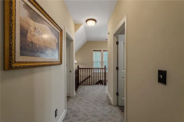 a living room with furniture a book shelf and a book shelf