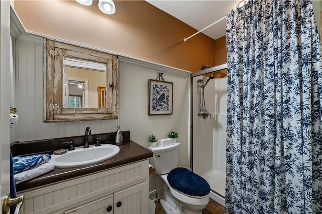 a kitchen with stainless steel appliances granite countertop white cabinets and a stove