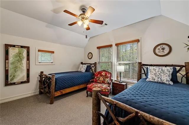a living room with furniture a fireplace and a potted plant