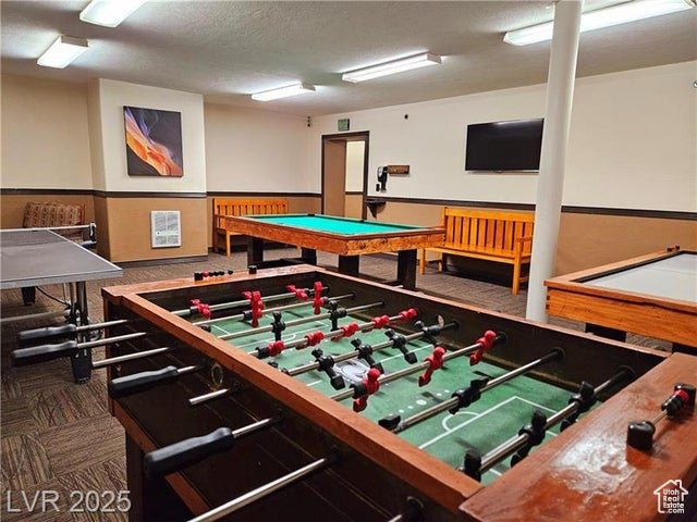 223 Hunter Ridge Drive, Unit E121 Brian Head, UT 84719 - Photo 30 of 35 Game room featuring carpet and a textured ceiling