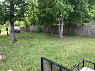 4221 Turnberry Road Lebanon, TN 37090 - Photo 5 of 22 a view of a backyard with large trees and wooden fence
