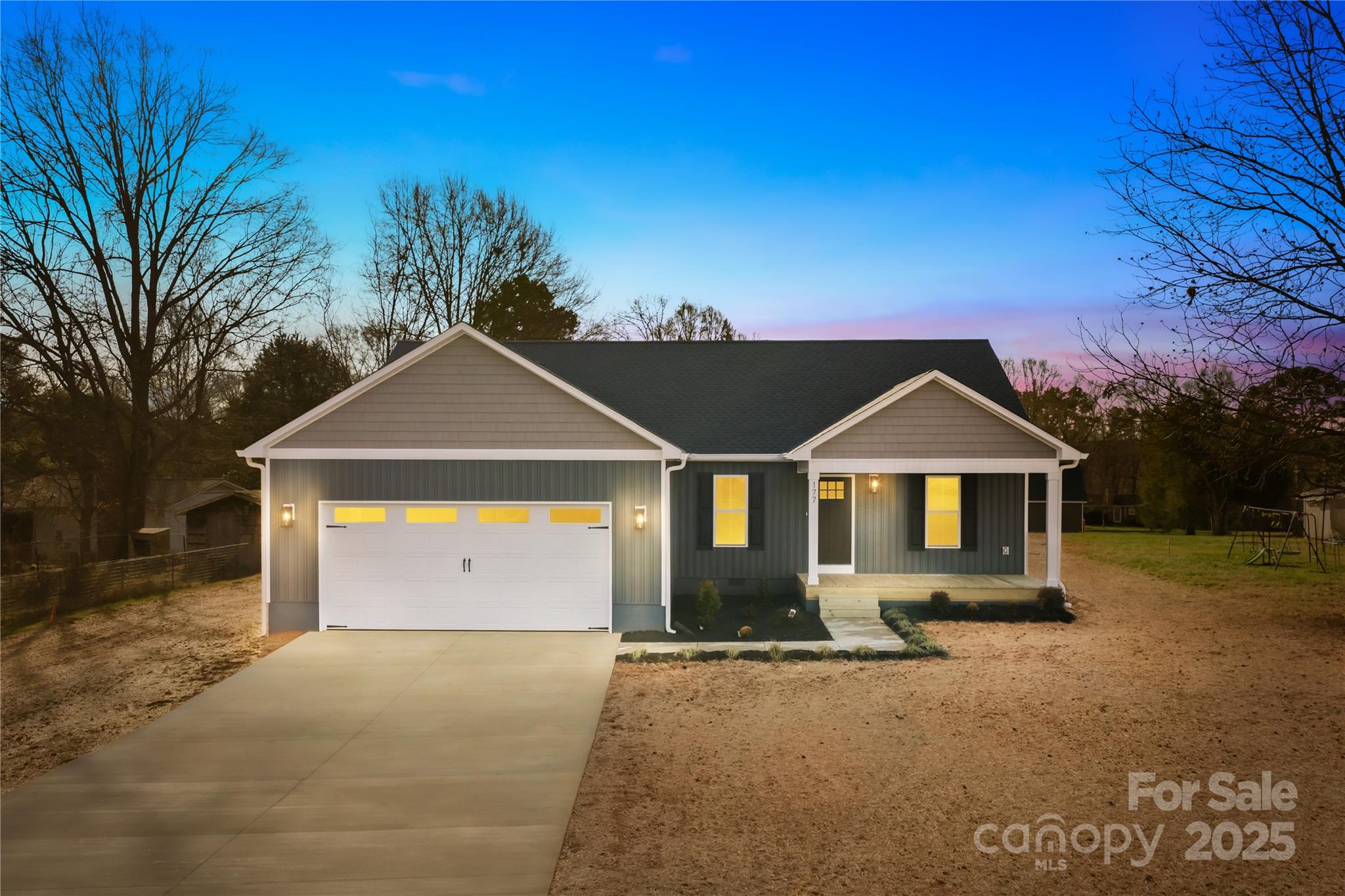 177 Monticello Road Statesville, NC 28625 - Photo 1 of 39 a front view of a house with a yard and garage