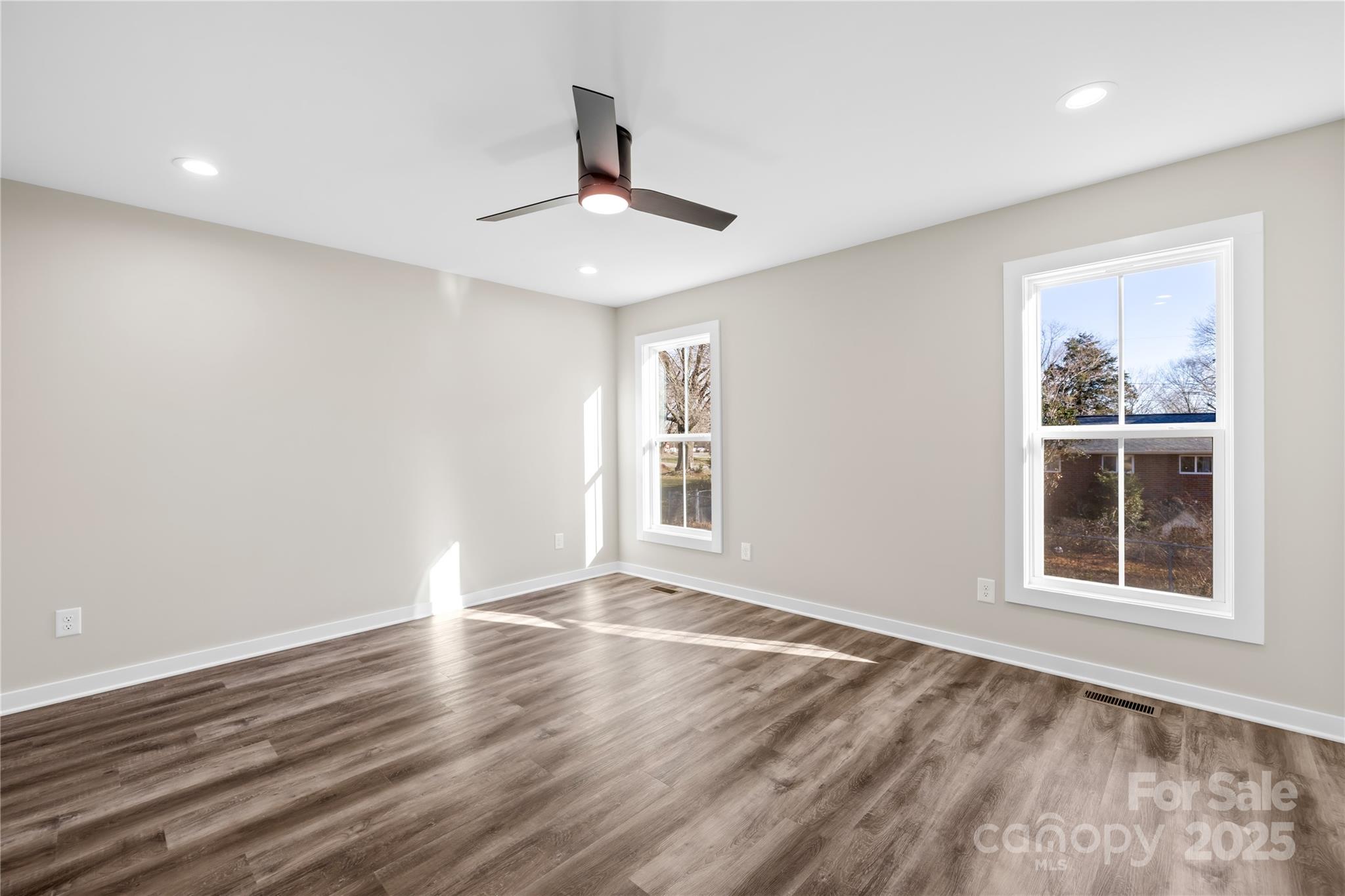177 Monticello Road Statesville, NC 28625 - Photo 15 of 39 a view of an empty room with wooden floor and a window