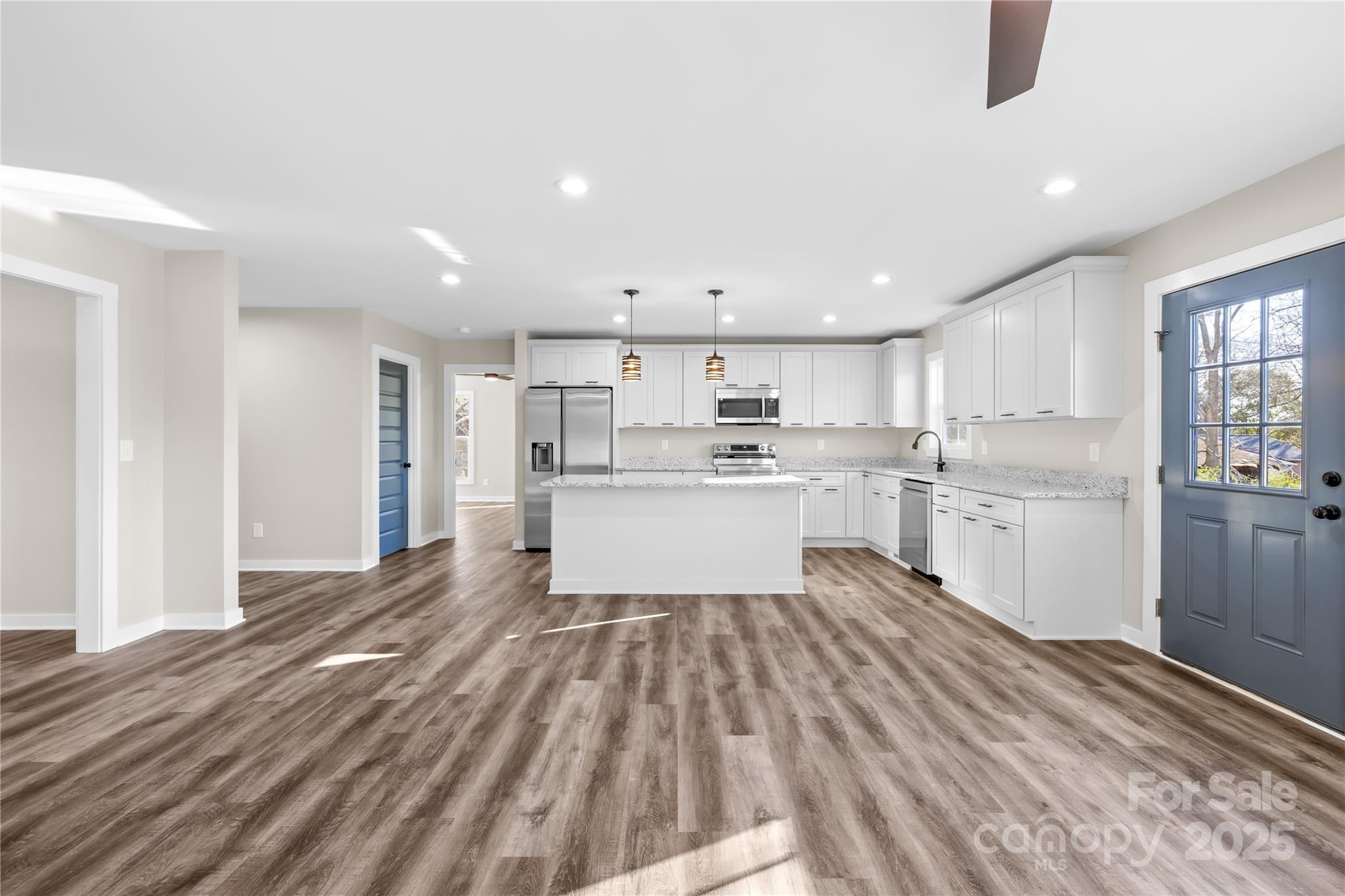 177 Monticello Road Statesville, NC 28625 - Photo 5 of 39 a large kitchen with cabinets and wooden floor