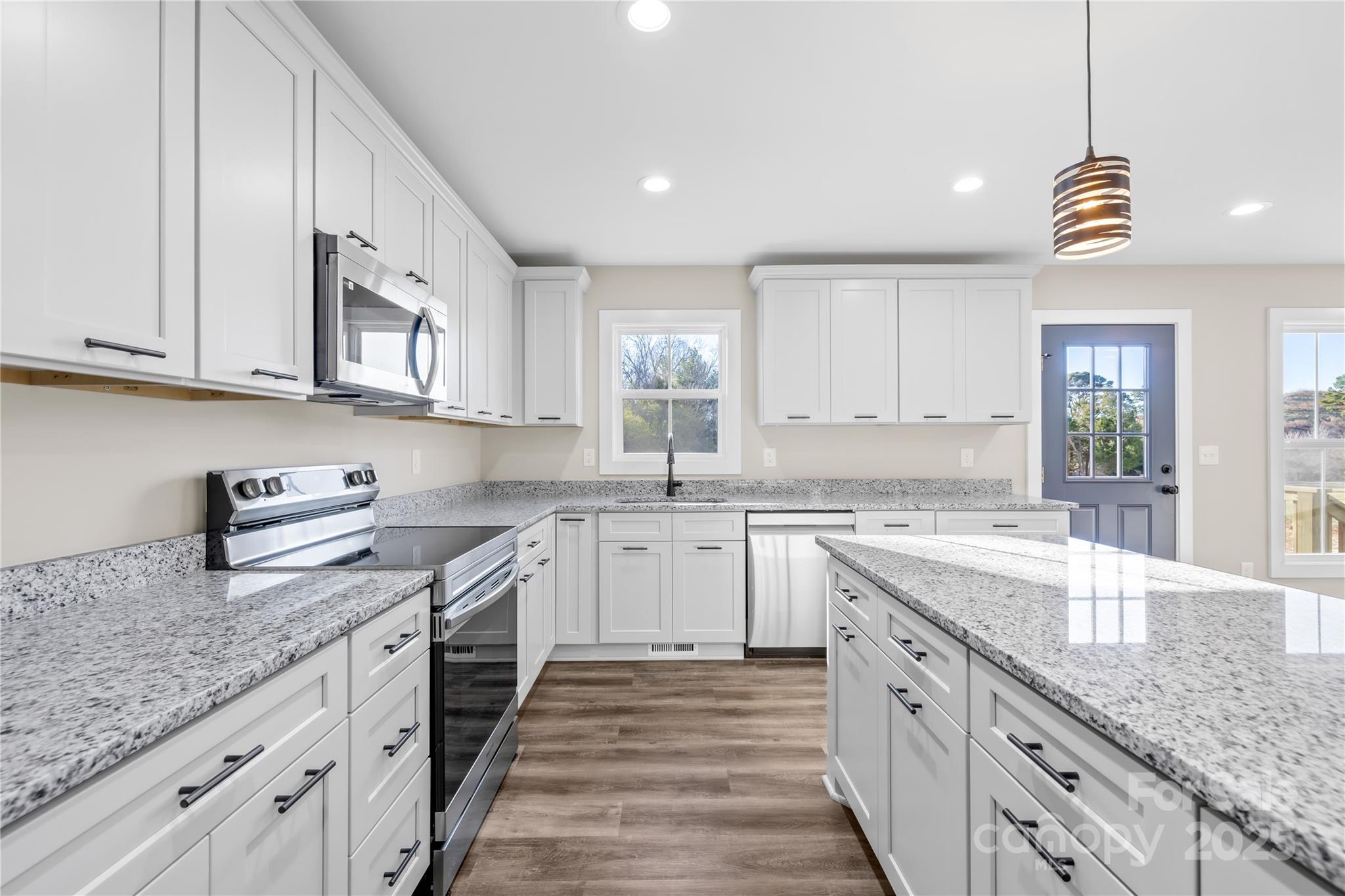 177 Monticello Road Statesville, NC 28625 - Photo 10 of 39 a kitchen with granite countertop cabinets stainless steel appliances a sink and a counter top space