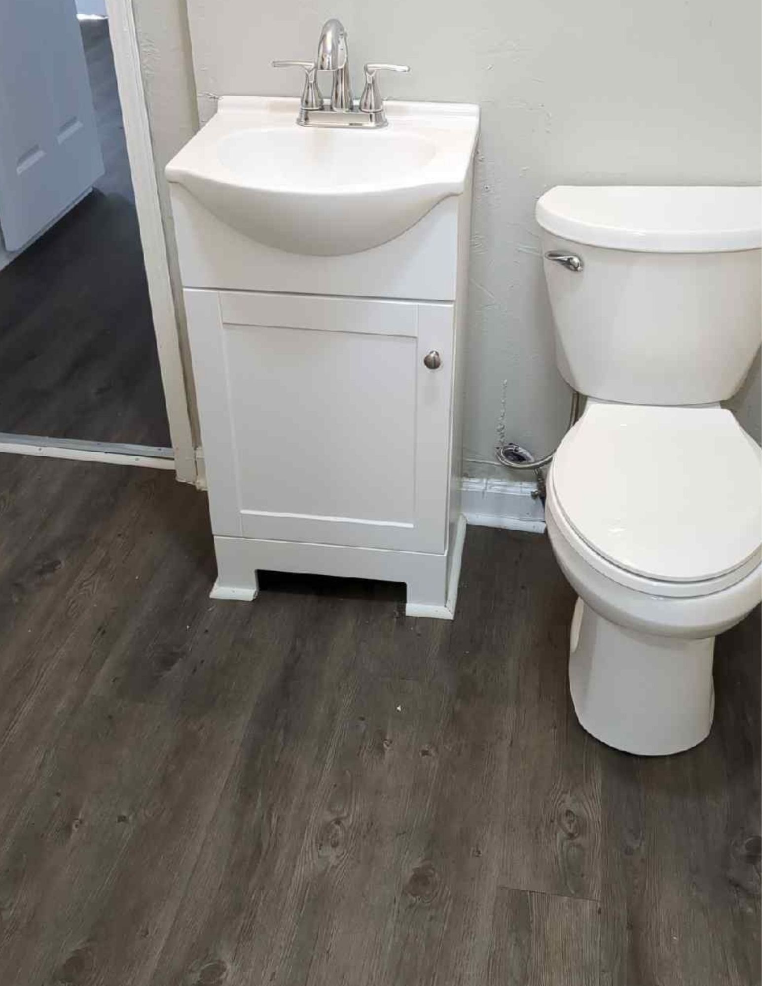 6684 Cavender Road Lyles, TN 37098 - Photo 11 of 13 a white toilet sitting next to a white sink