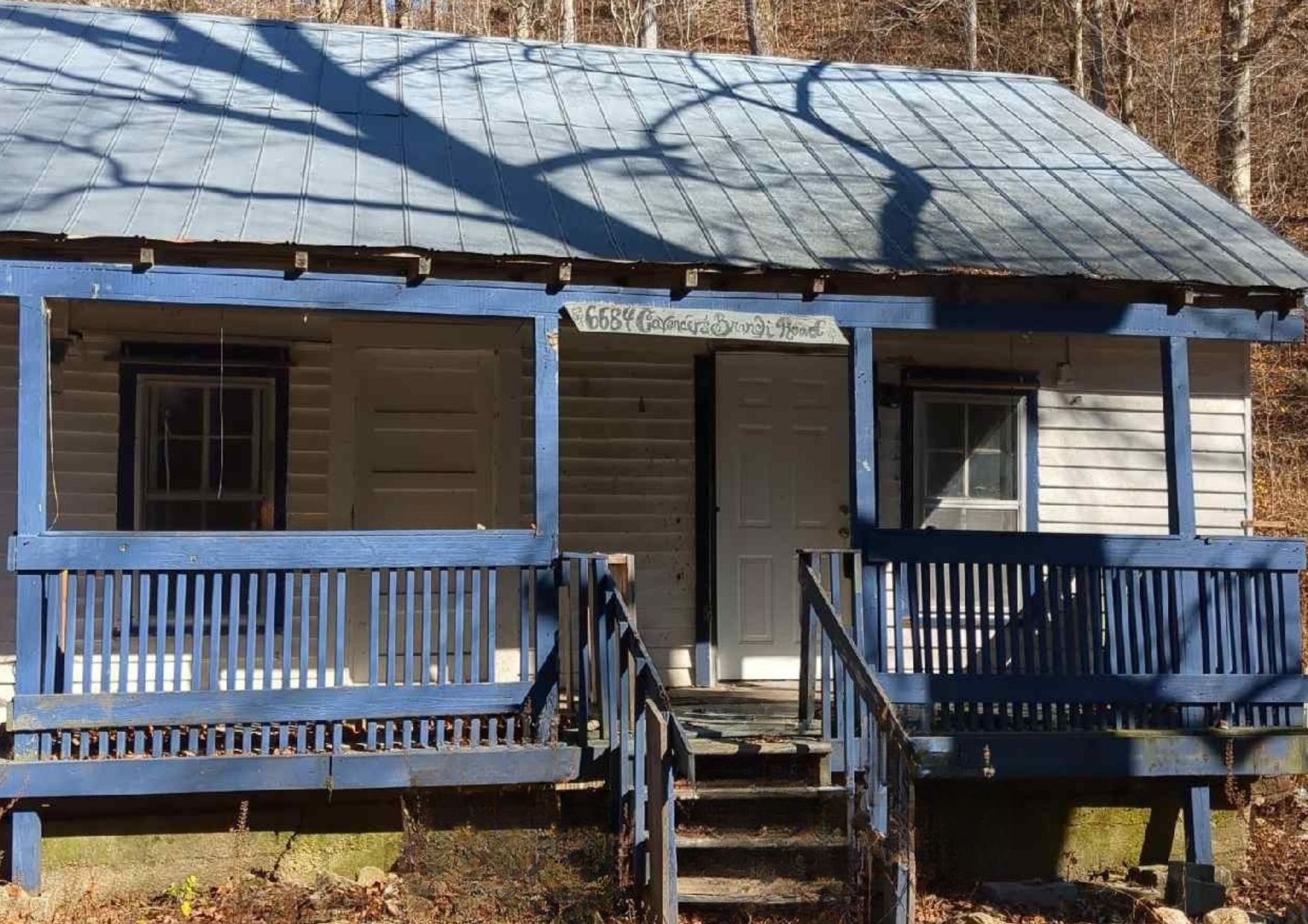 6684 Cavender Road Lyles, TN 37098 - Photo 12 of 13 a view of a house with a roof deck