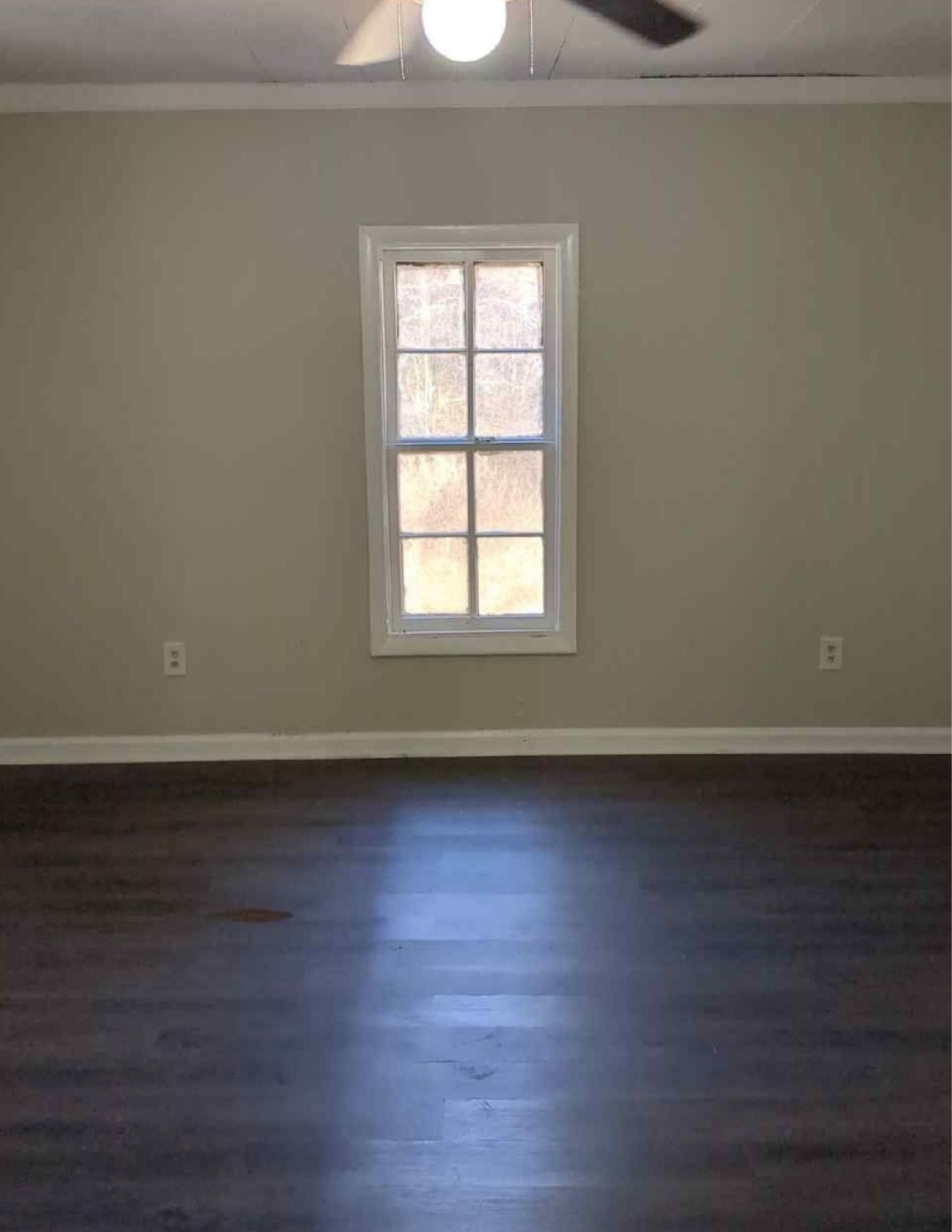 6684 Cavender Road Lyles, TN 37098 - Photo 3 of 13 an empty room with wooden floor and windows