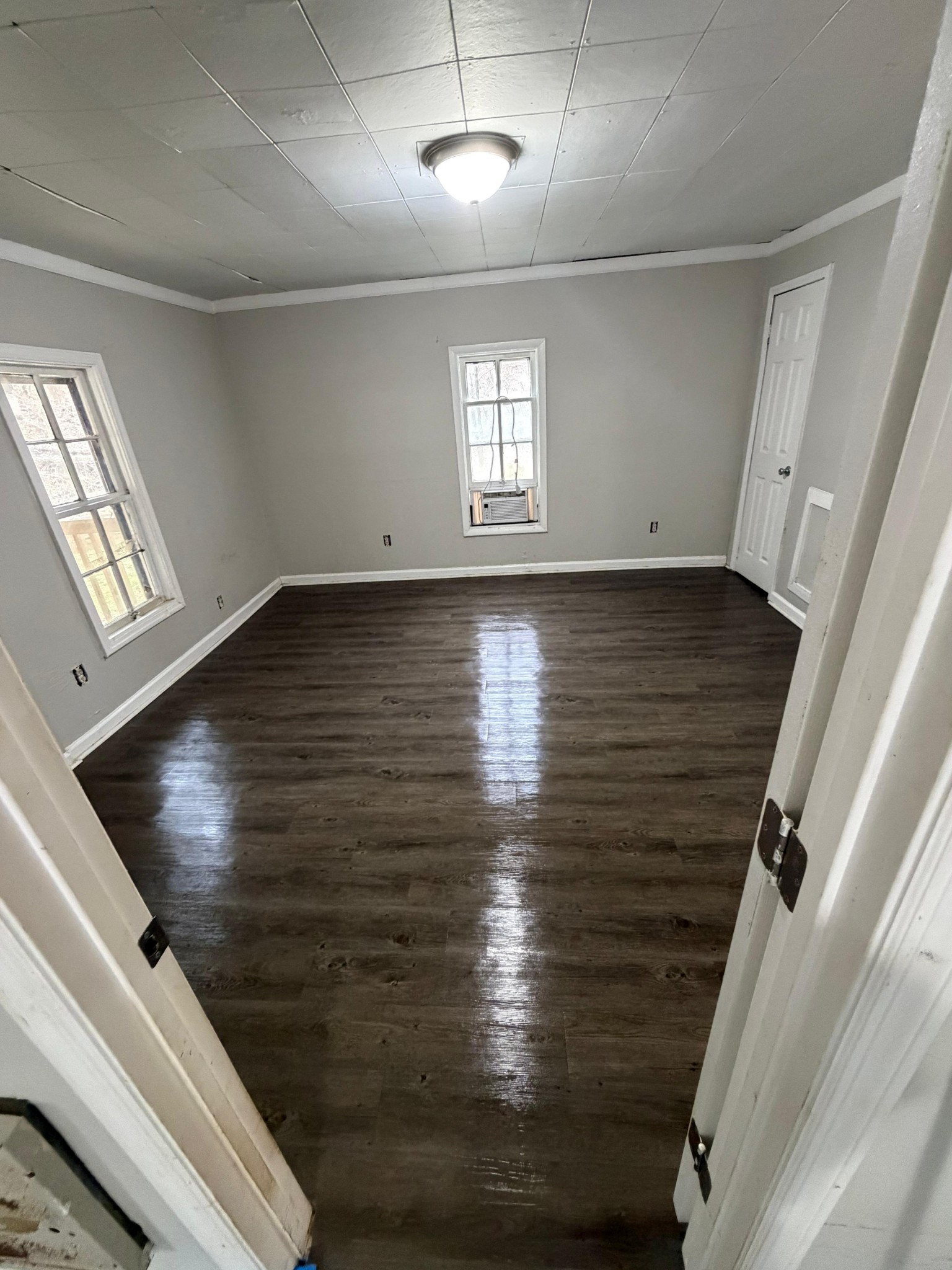 6684 Cavender Road Lyles, TN 37098 - Photo 5 of 13 wooden floor in an empty room with window
