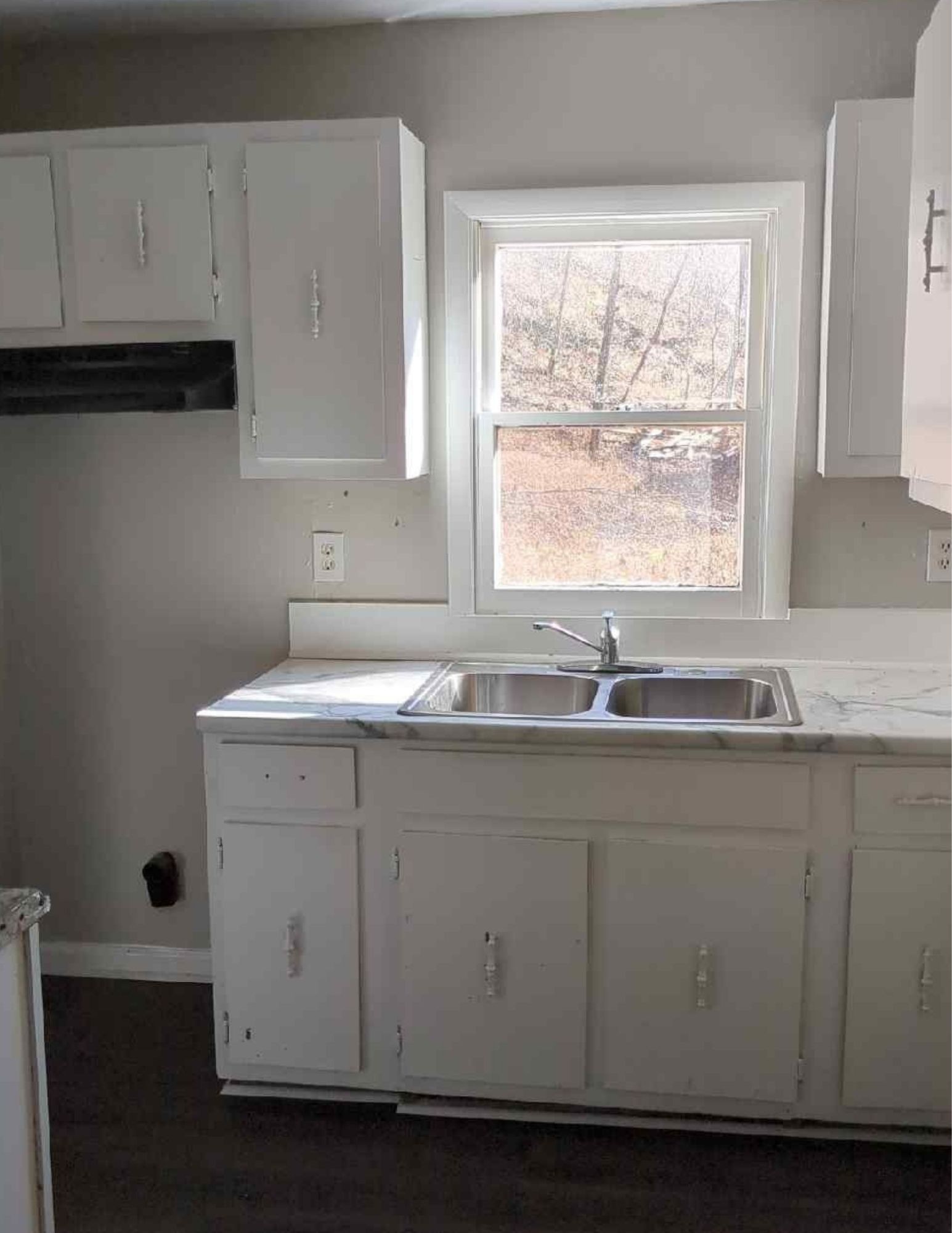 6684 Cavender Road Lyles, TN 37098 - Photo 7 of 13 a view of cabinets a sink and a window in a kitchen