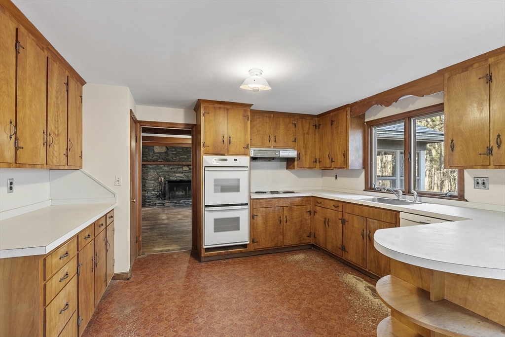 19 Partridge Hill Road Harvard, MA 01451 - Photo 13 of 42 a kitchen with granite countertop a sink stove and refrigerator