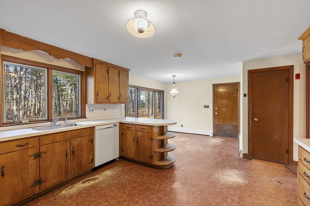 19 Partridge Hill Road Harvard, MA 01451 - Photo 14 of 42 a large kitchen with lot of cabinets and stainless steel appliances