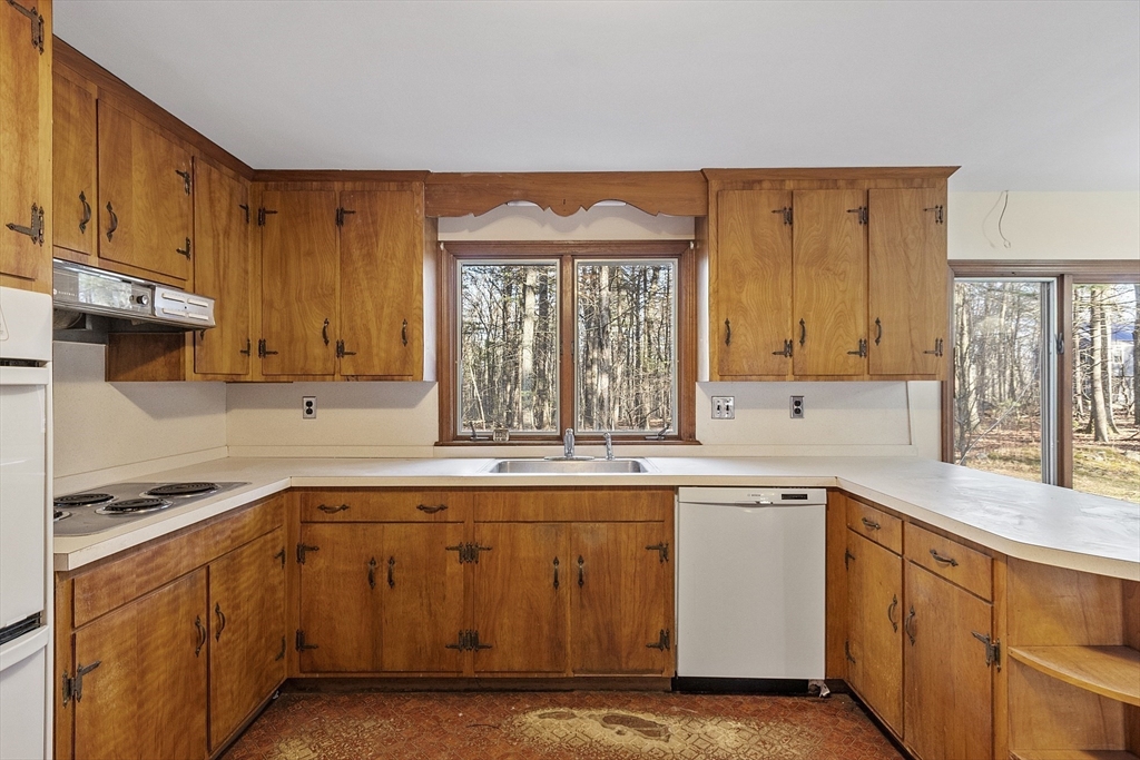 19 Partridge Hill Road Harvard, MA 01451 - Photo 15 of 42 a kitchen with a sink window and cabinets