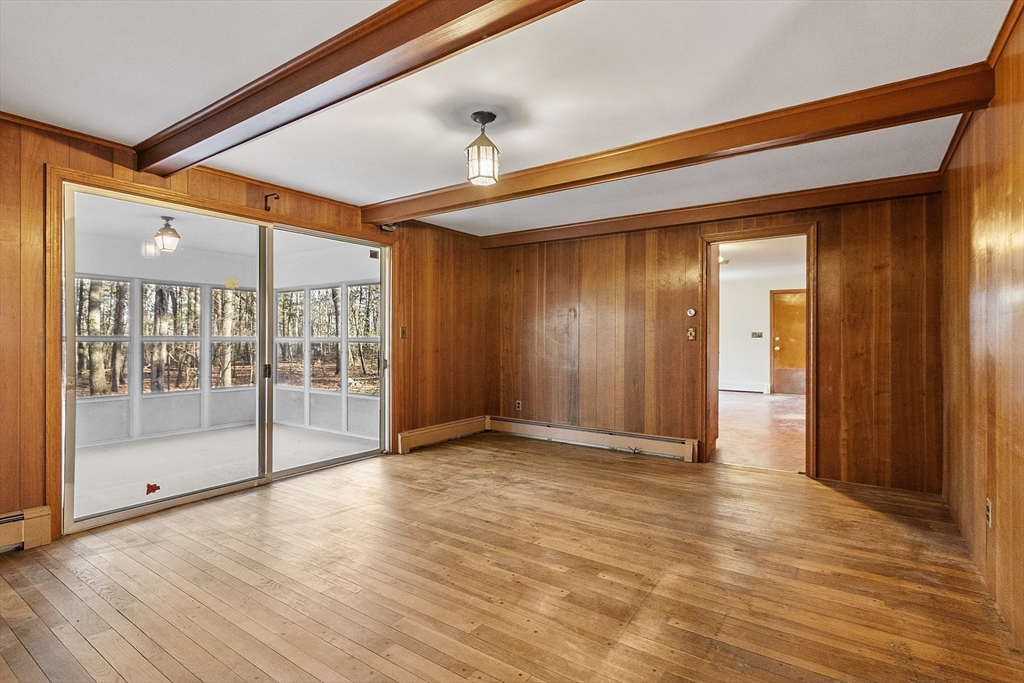 19 Partridge Hill Road Harvard, MA 01451 - Photo 22 of 42 a view of empty room with wooden floor and fan