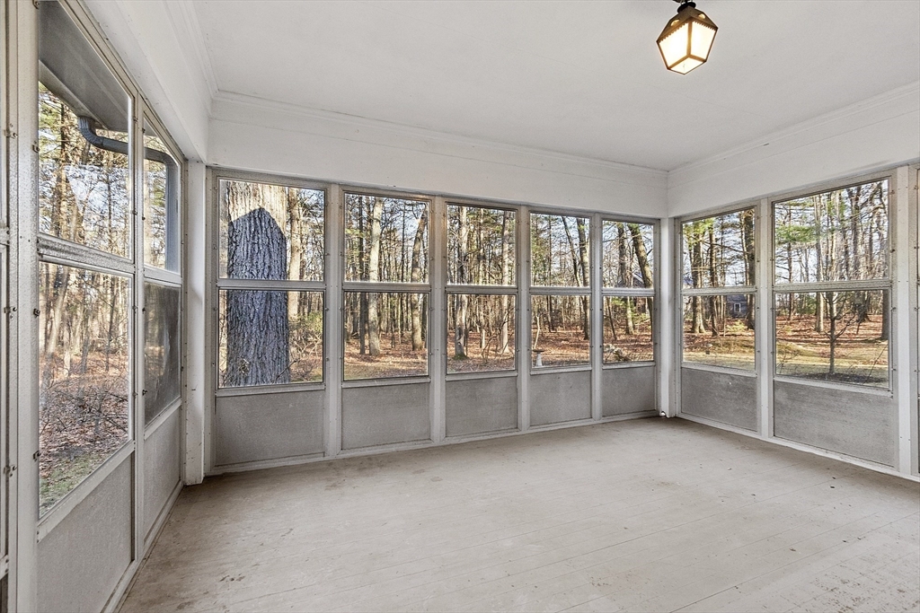 19 Partridge Hill Road Harvard, MA 01451 - Photo 24 of 42 a living room with furniture and a large window with outer view