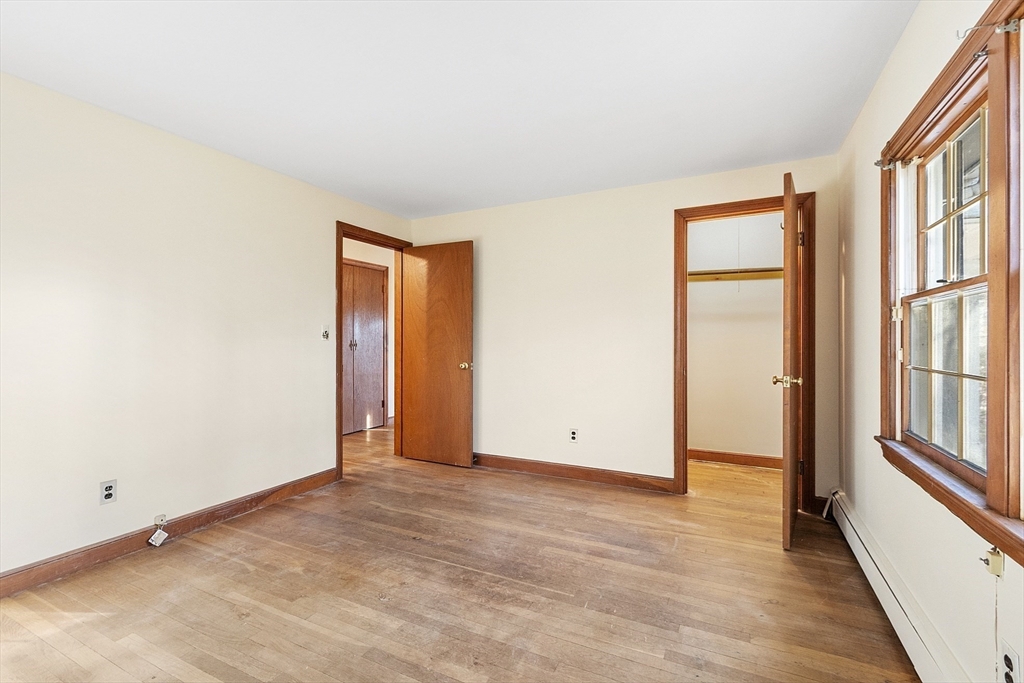 19 Partridge Hill Road Harvard, MA 01451 - Photo 30 of 42 an empty room with wooden floor and windows