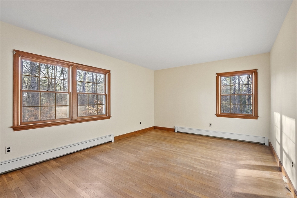 19 Partridge Hill Road Harvard, MA 01451 - Photo 31 of 42 an empty room with wooden floor and windows
