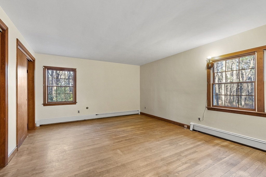 19 Partridge Hill Road Harvard, MA 01451 - Photo 34 of 42 an empty room with wooden floor and windows