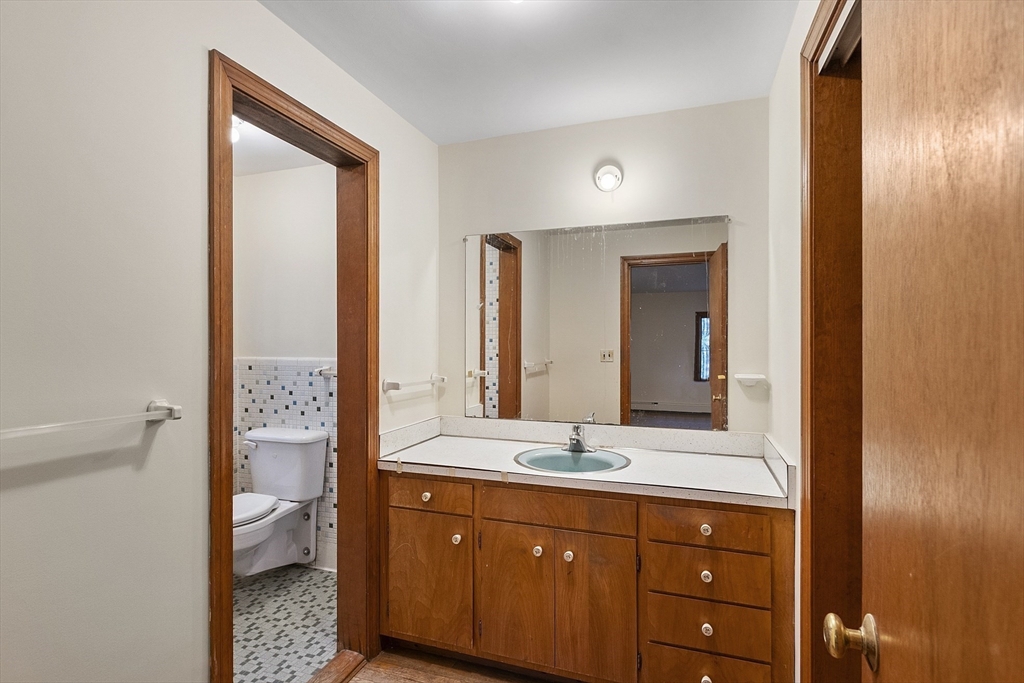 19 Partridge Hill Road Harvard, MA 01451 - Photo 37 of 42 a bathroom with a double vanity sink and a mirror