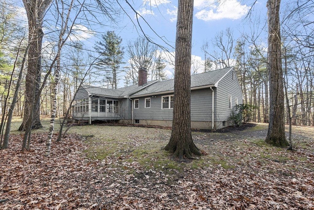 19 Partridge Hill Road Harvard, MA 01451 - Photo 39 of 42 a view of a house with a yard covered in the forest