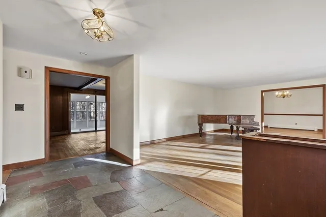 a view of a room with a ceiling fan