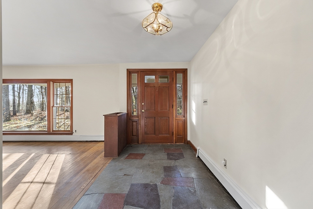 19 Partridge Hill Road Harvard, MA 01451 - Photo 6 of 42 a view of an empty room with a window