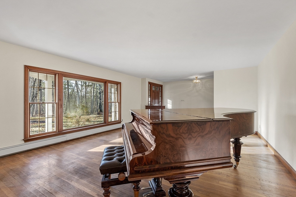 19 Partridge Hill Road Harvard, MA 01451 - Photo 9 of 42 a living room with wooden floor and large window