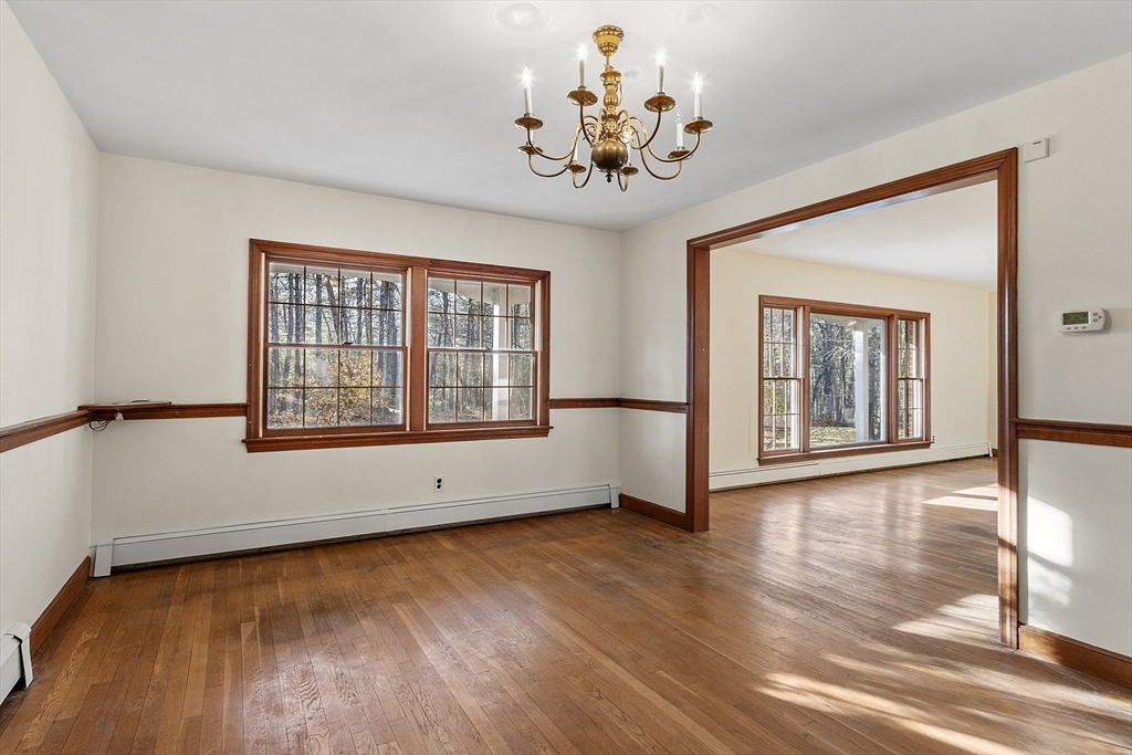 19 Partridge Hill Road Harvard, MA 01451 - Photo 10 of 42 a view of an empty room with a window and wooden floor