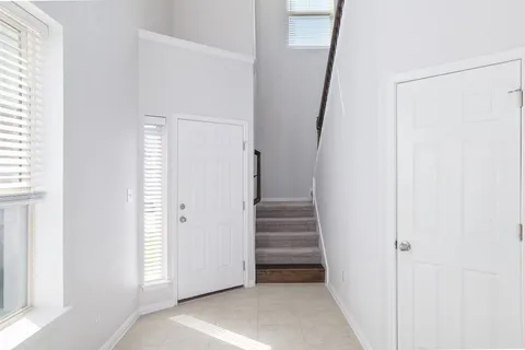 a view of a hallway with staircase