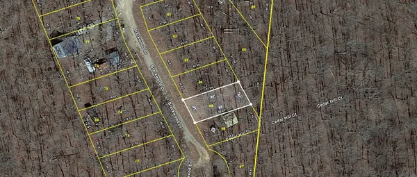 a view of roof with wooden wall and windows
