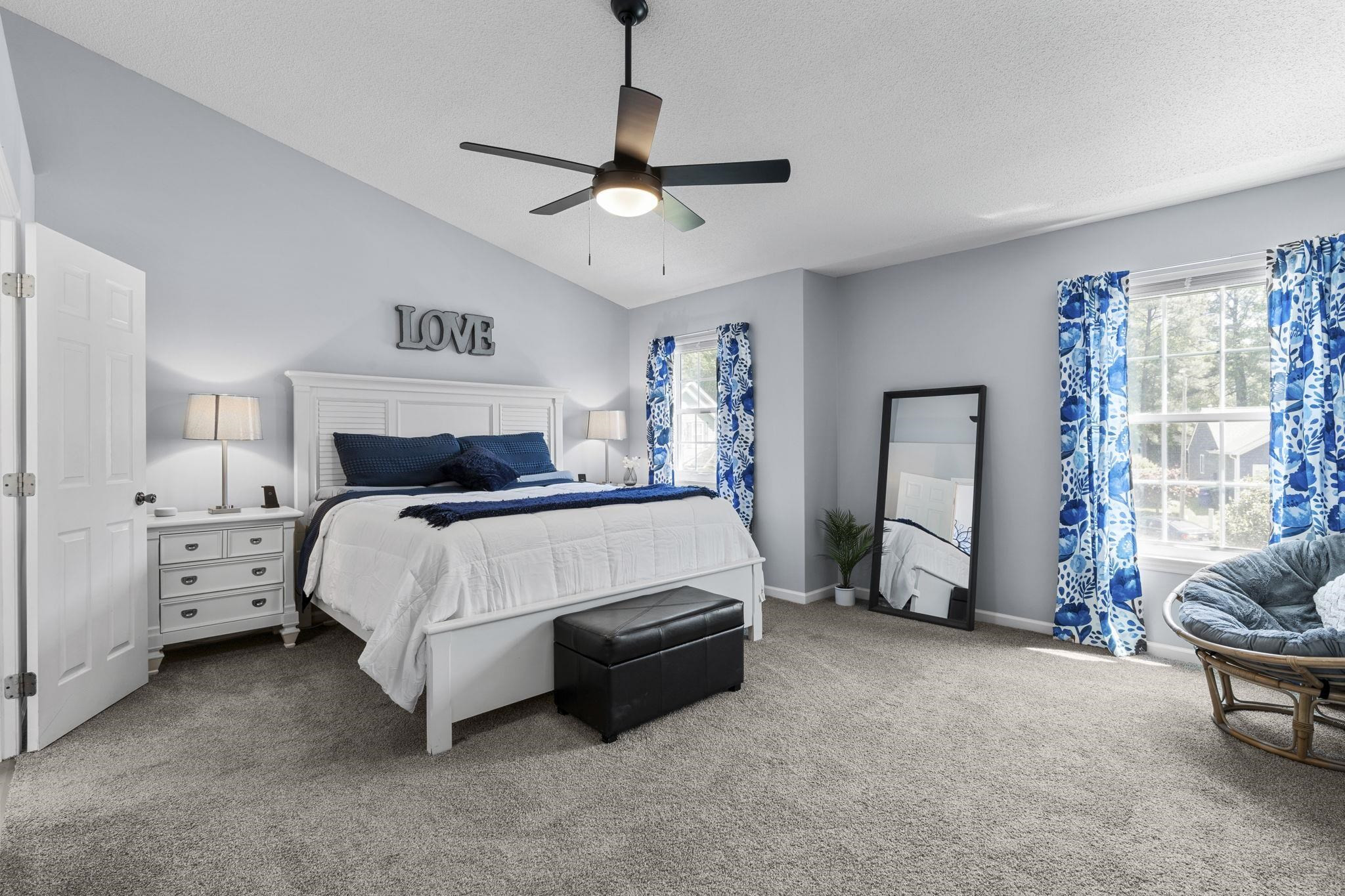 6809 Fereday Court Raleigh, NC 27616 - Photo 11 of 21 a bedroom with a bed and a chandelier