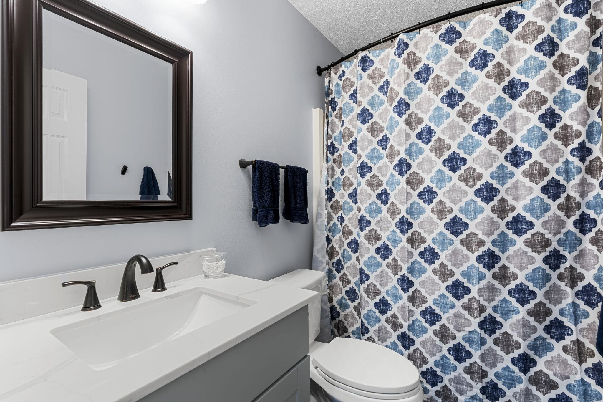 6809 Fereday Court Raleigh, NC 27616 - Photo 16 of 21 a bathroom with a sink toilet and mirror