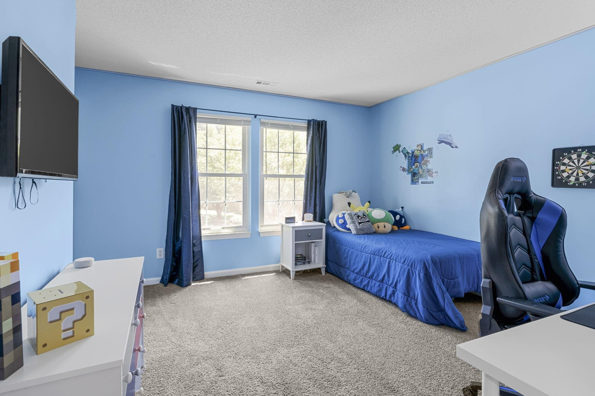 6809 Fereday Court Raleigh, NC 27616 - Photo 17 of 21 a bed room with a bed and a window