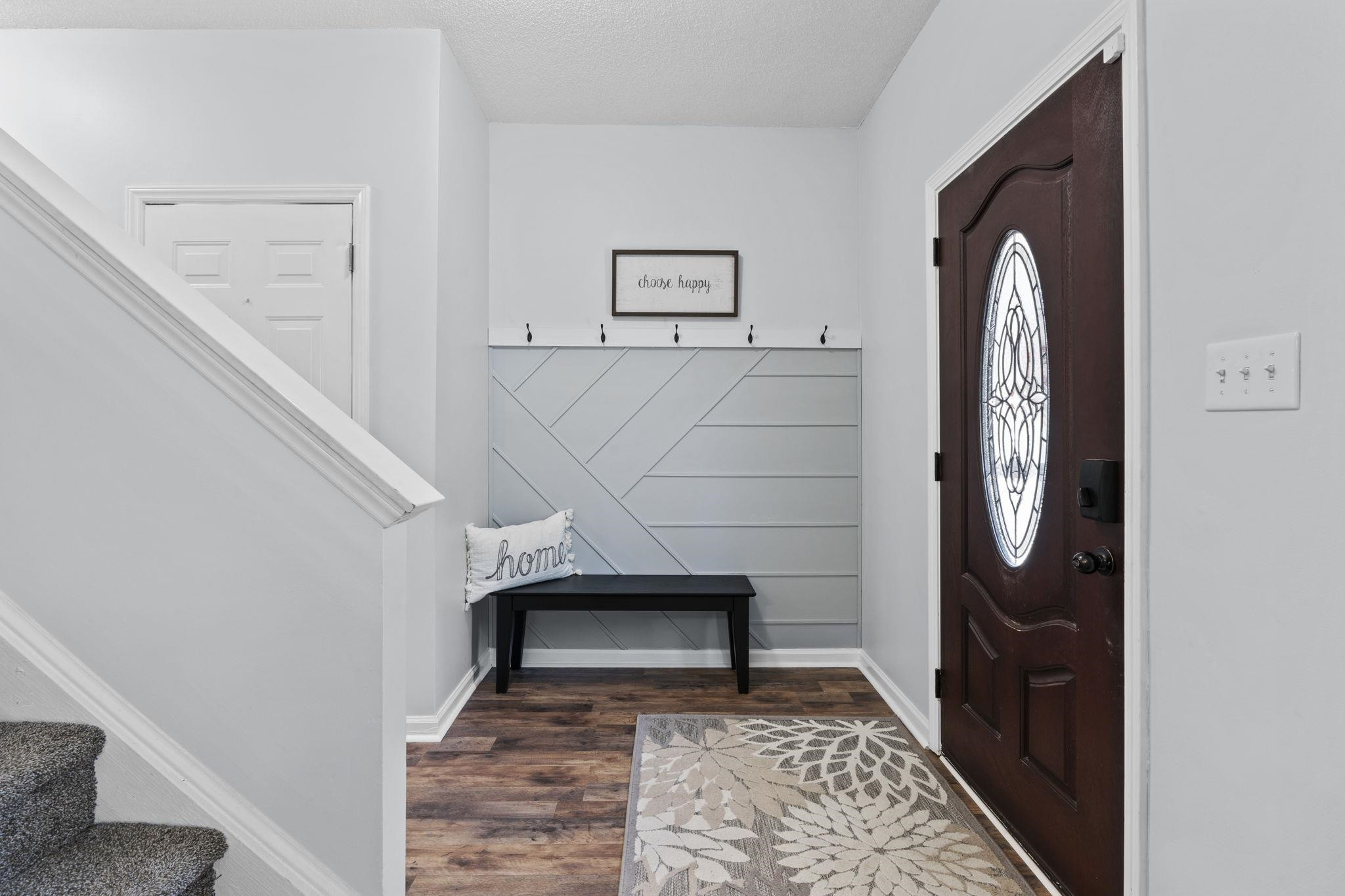 6809 Fereday Court Raleigh, NC 27616 - Photo 2 of 21 a view of staircase with a rug