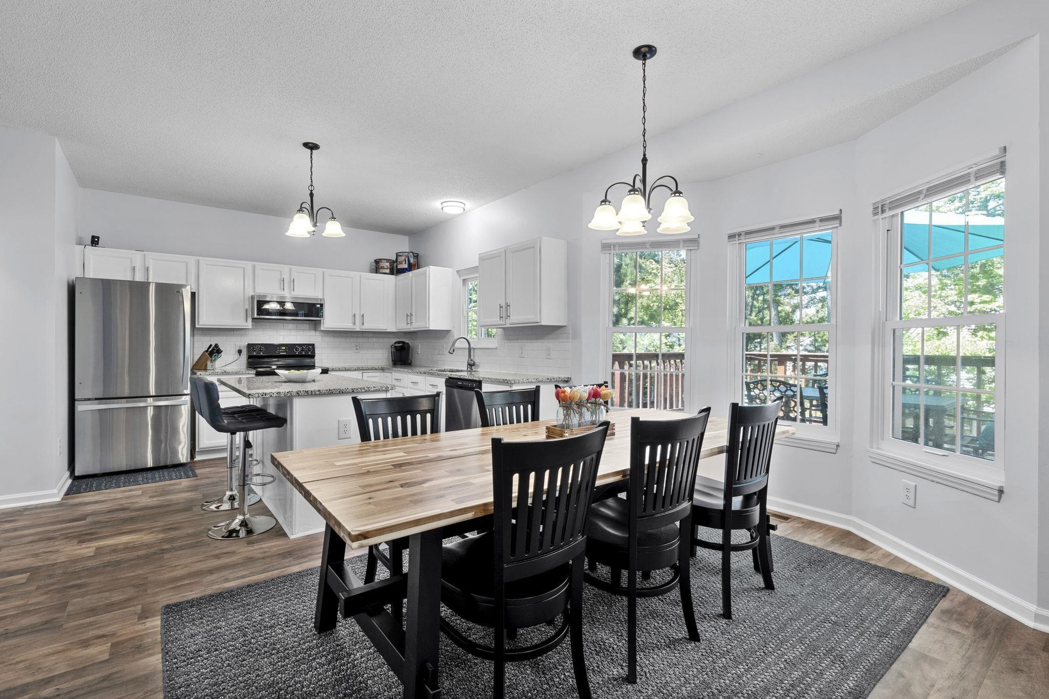 6809 Fereday Court Raleigh, NC 27616 - Photo 6 of 21 a view of a dining room with furniture window and wooden floor