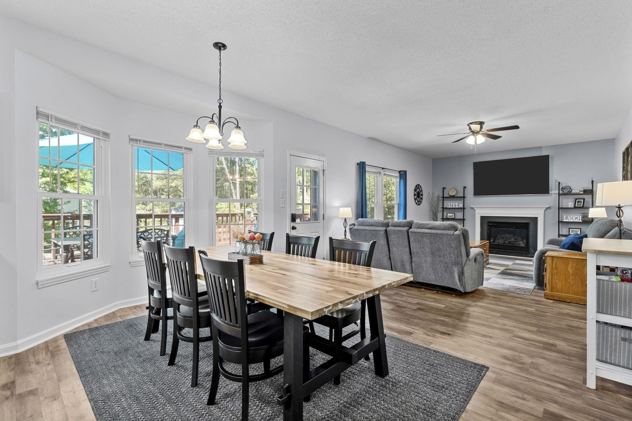6809 Fereday Court Raleigh, NC 27616 - Photo 7 of 21 a view of a dining room with furniture window and wooden floor
