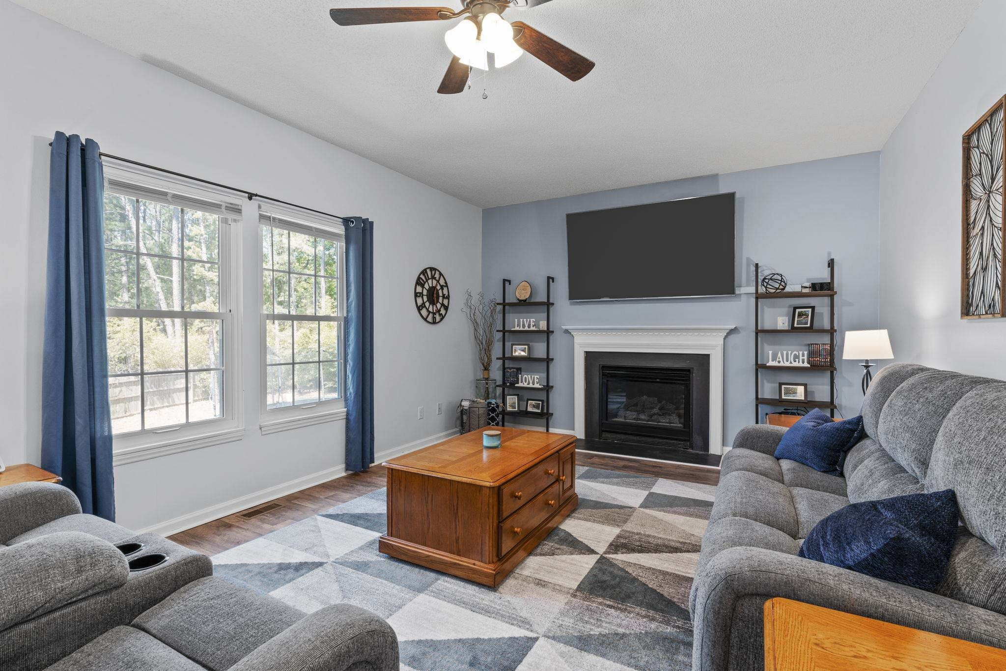 6809 Fereday Court Raleigh, NC 27616 - Photo 8 of 21 a living room with furniture and a fireplace