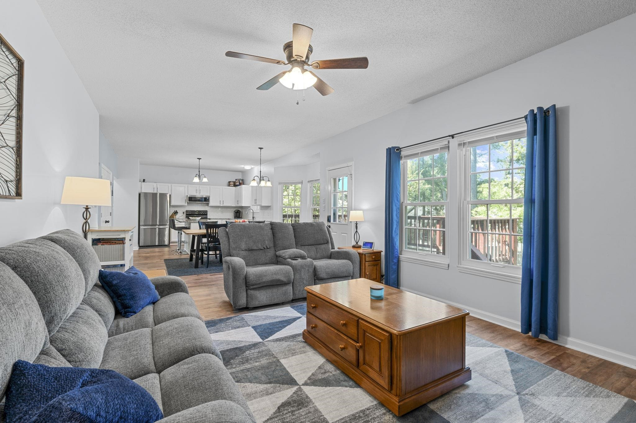 6809 Fereday Court Raleigh, NC 27616 - Photo 9 of 21 a living room with furniture ceiling fan and a window