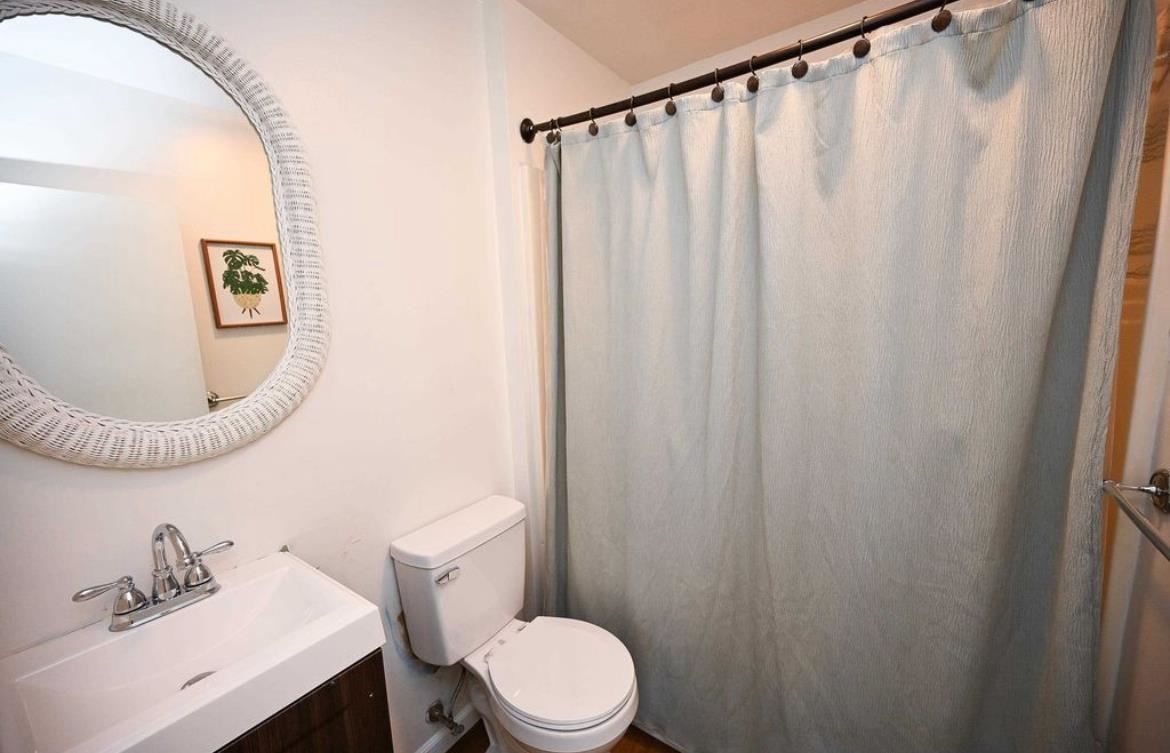 214 Sunray Road Del Haven, NJ 08251 - Photo 12 of 23 a bathroom with a sink mirror and toilet