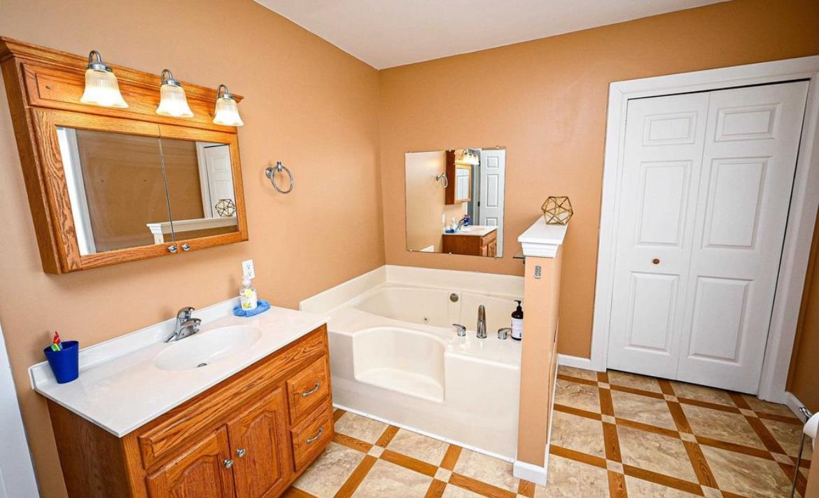 214 Sunray Road Del Haven, NJ 08251 - Photo 16 of 23 a bathroom with a sink vanity and a mirror
