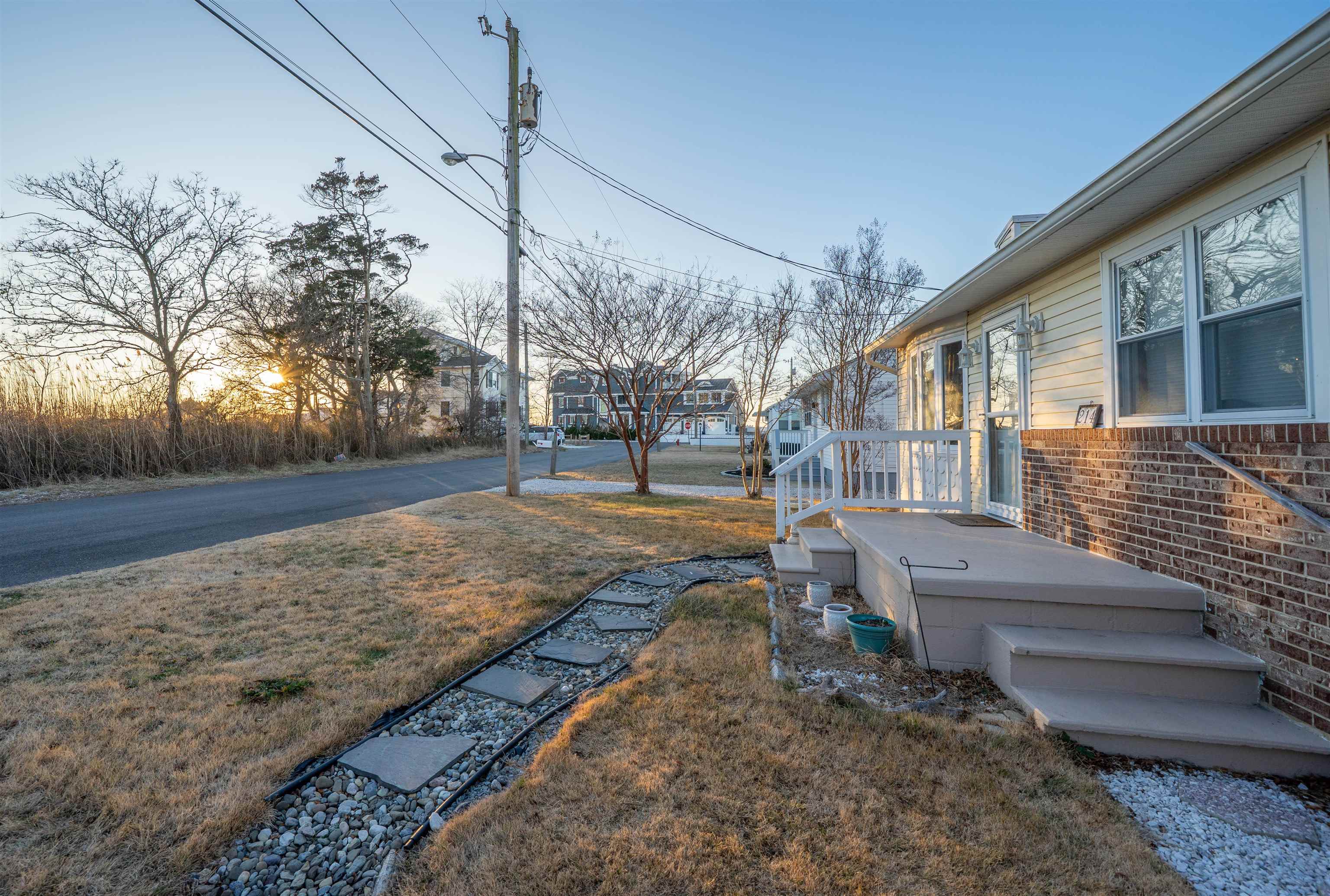 214 Sunray Road Del Haven, NJ 08251 - Photo 20 of 23 a view of a yard with a house
