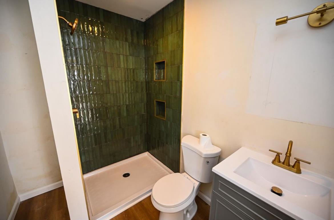 214 Sunray Road Del Haven, NJ 08251 - Photo 7 of 23 a bathroom with a sink a toilet and shower