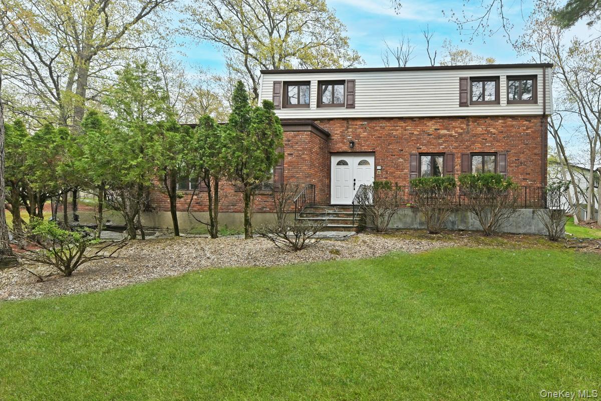 19 Sterling Road Spring Valley, NY 10977 - Photo 1 of 20 a front view of a house with a garden