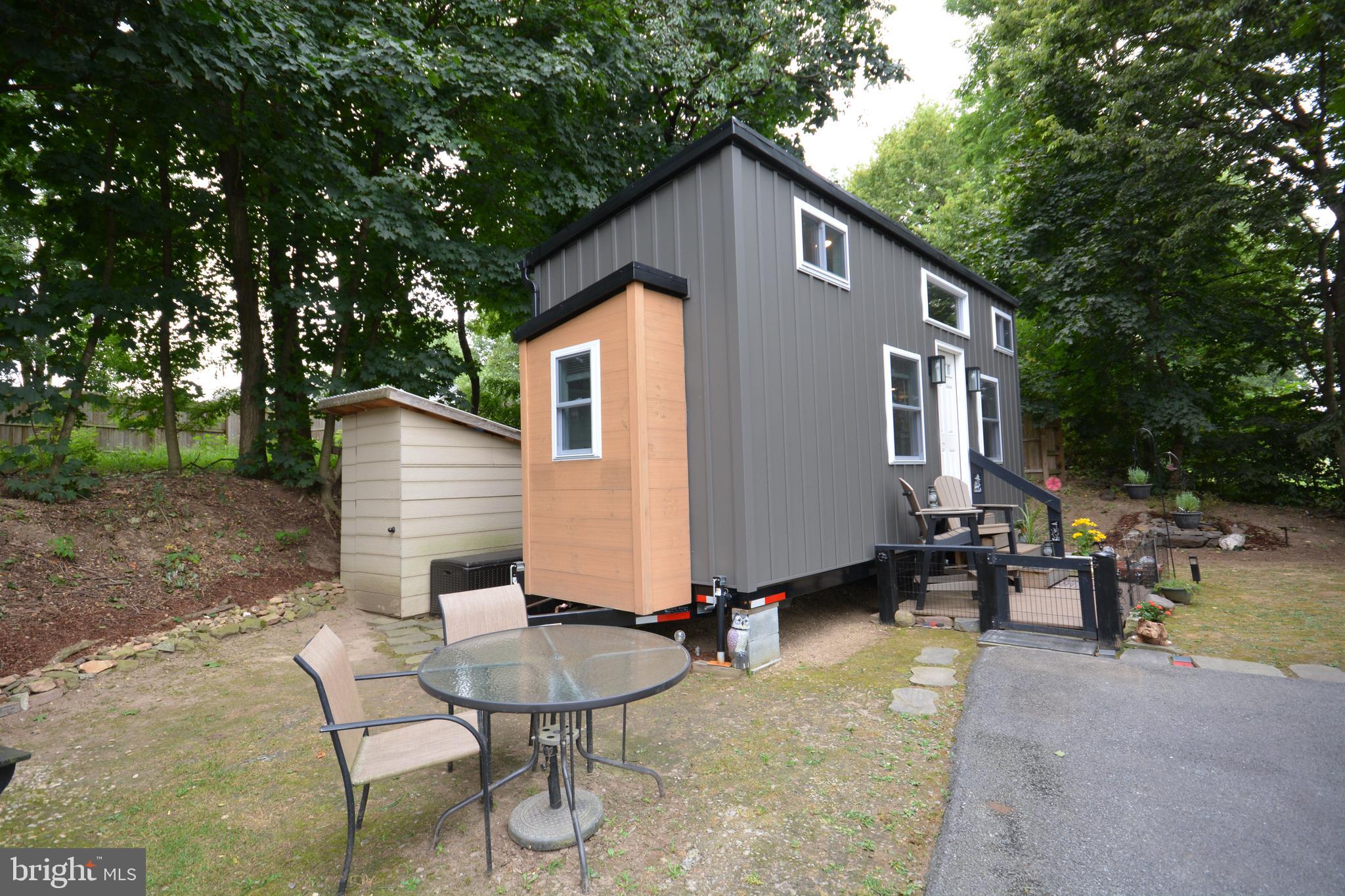 867 Schwanger Road Elizabethtown, PA 17022 - Photo 7 of 8 a backyard of a house with table and chairs