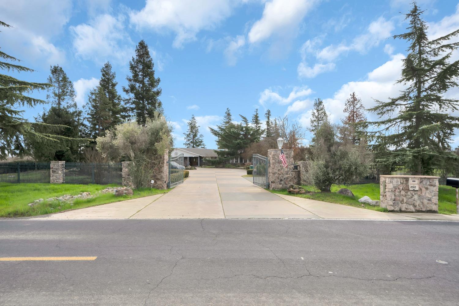 5420 East Jahant Road Galt, CA 95632 - Photo 11 of 73 a street view with large trees