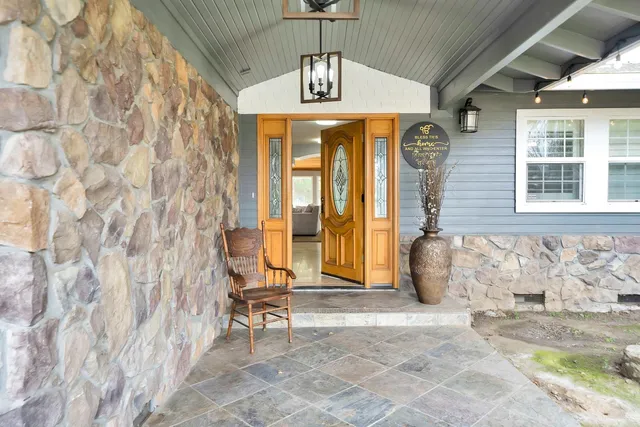 a view of green field with trees around